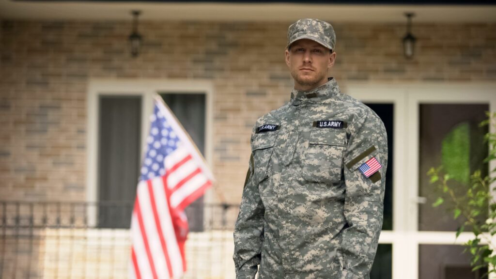 Disabled veteran in front of building