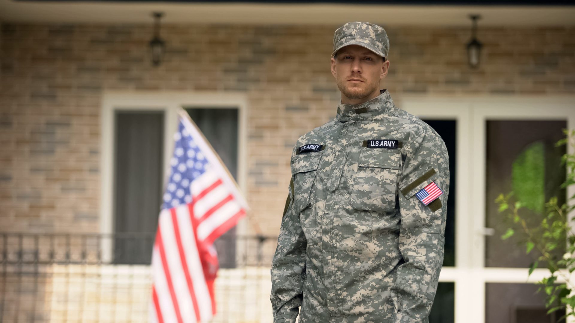 Disabled veteran in front of building