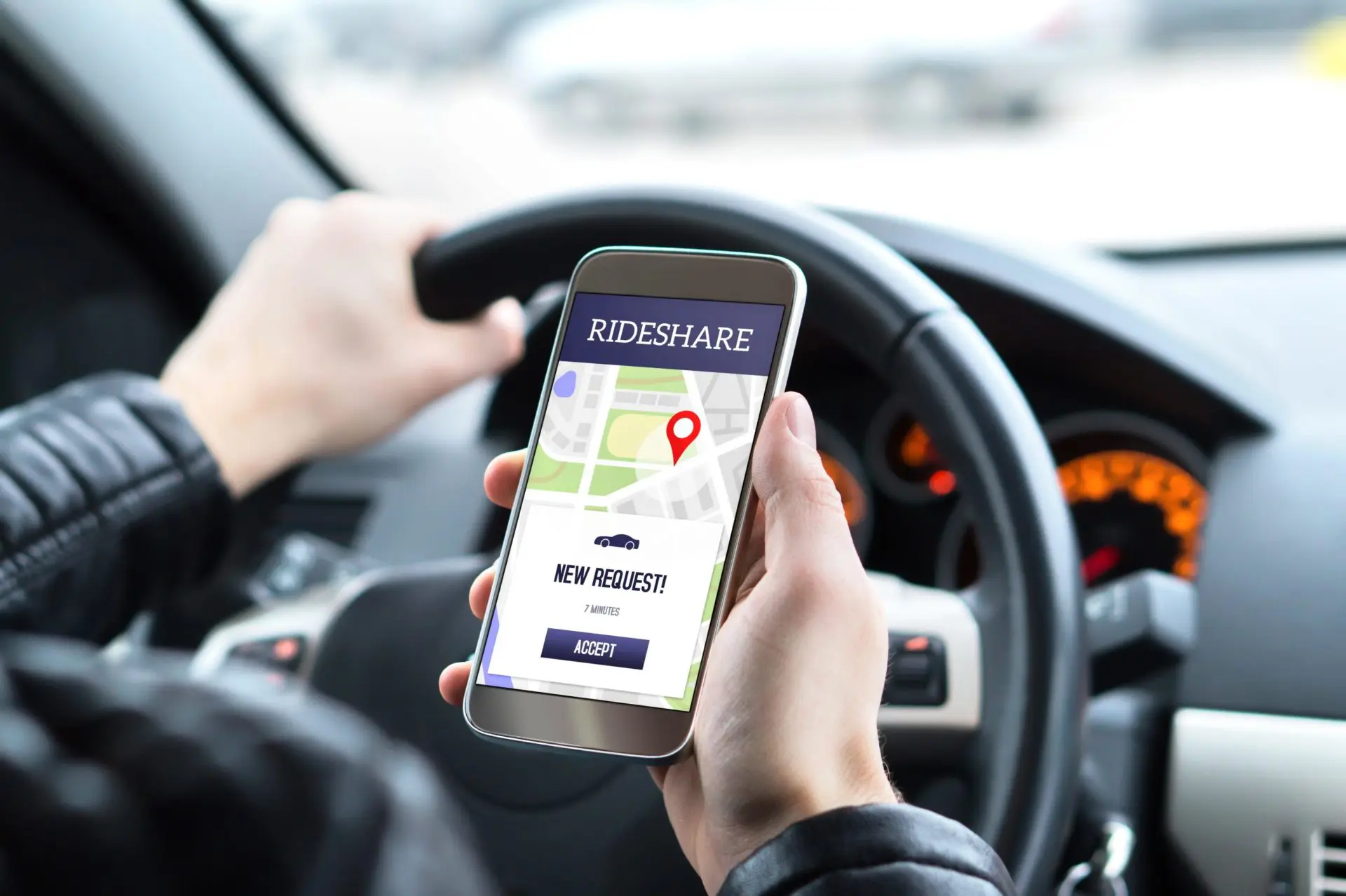 Ride Share Driver In Car Using The Rideshare App In Mobile Phone